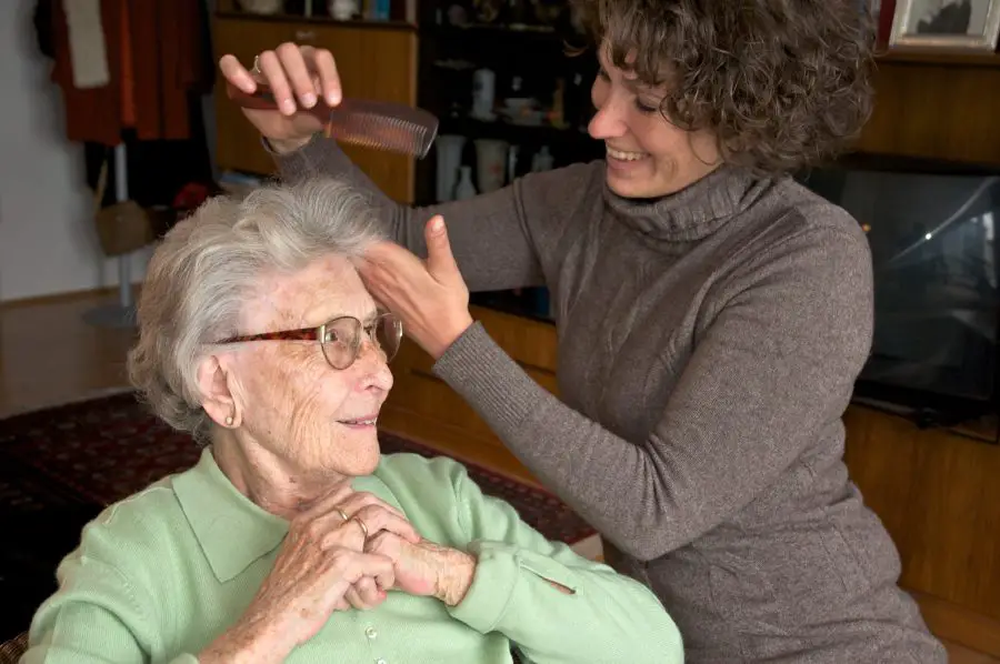 Elderly woman getting hair done