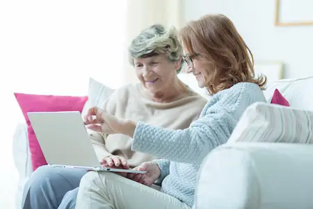 Kind carer teaching old lady Best books for caregivers