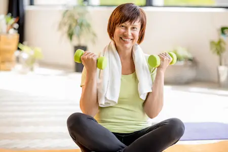 Older woman doing yoga indoors Exercises for Seniors to Do at Home | Home Workouts for Seniors